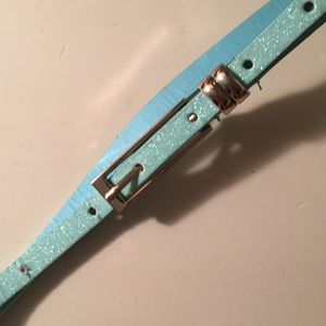 light blue sparkly belt with gold buckle